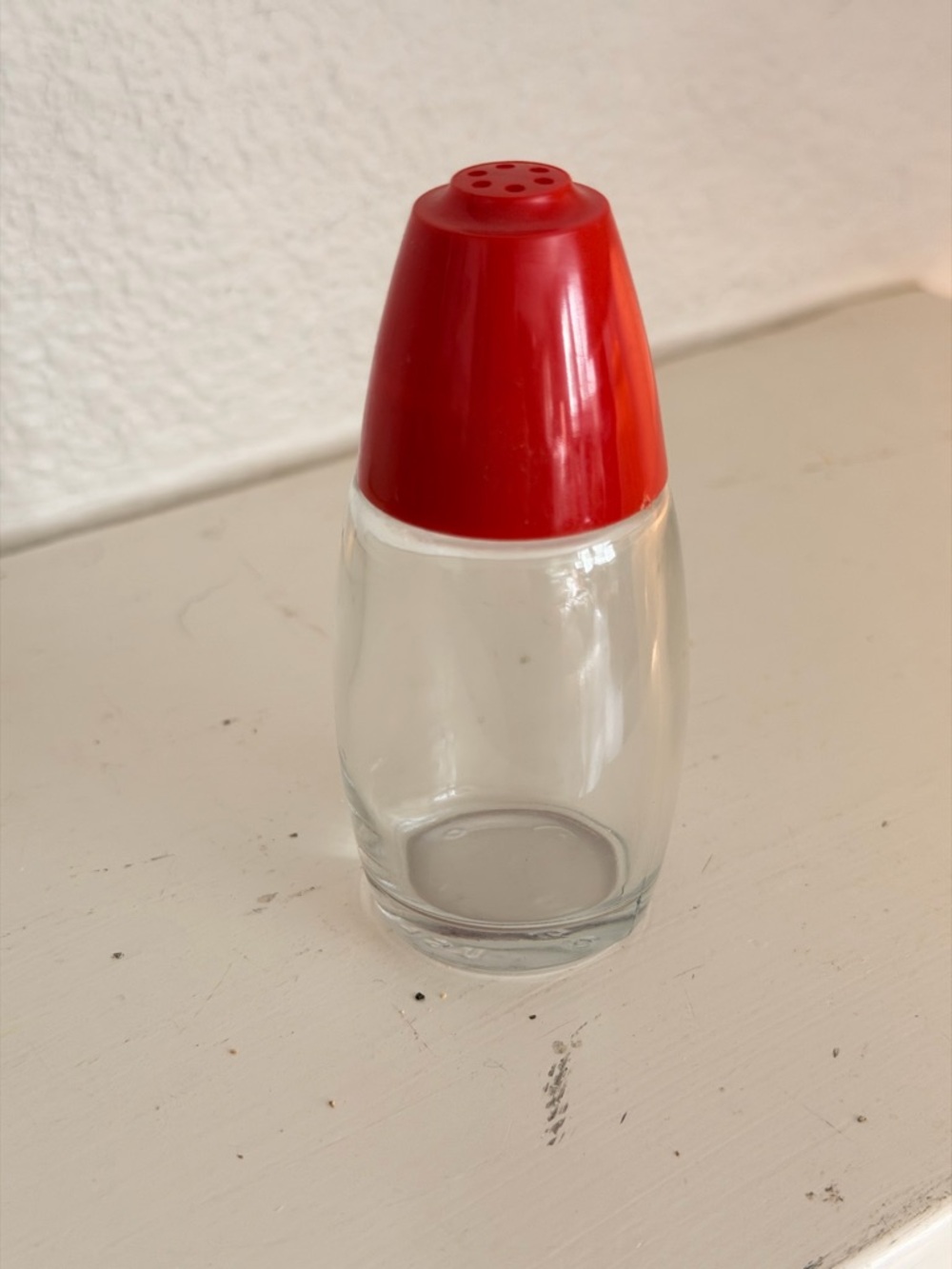 Vintage glass salt shaker with red lid (retro diner style)
